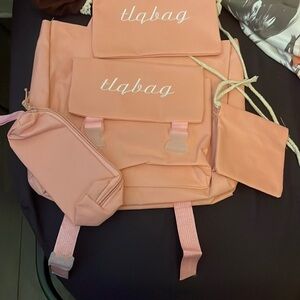 4 piece set.  A tote bag or backpack with a makeup bag a sm bag for anything